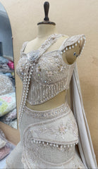 Ivory Pearl Embellished Fish Cut Designer Lehenga Set with Sculpted Corset Blouse & Dramatic Draped Trail